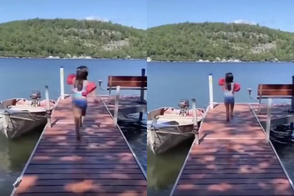 Une petite fille saute d'un ponton