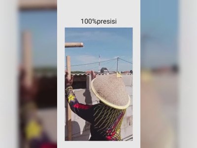 Des ouvriers coupent une brique à vue d'oeil